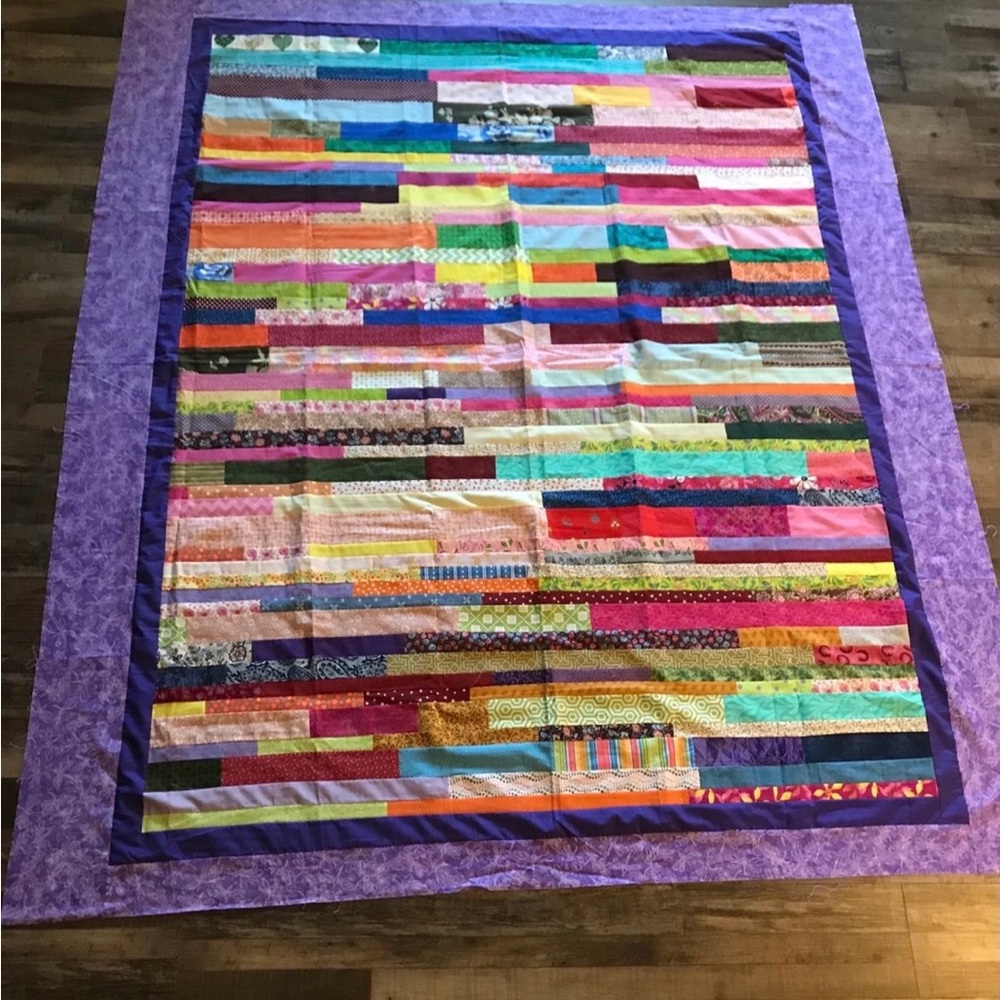 Colorful Scrappy. Quilt Too with Purple Border NOT A QUILT YET  72” X 82”